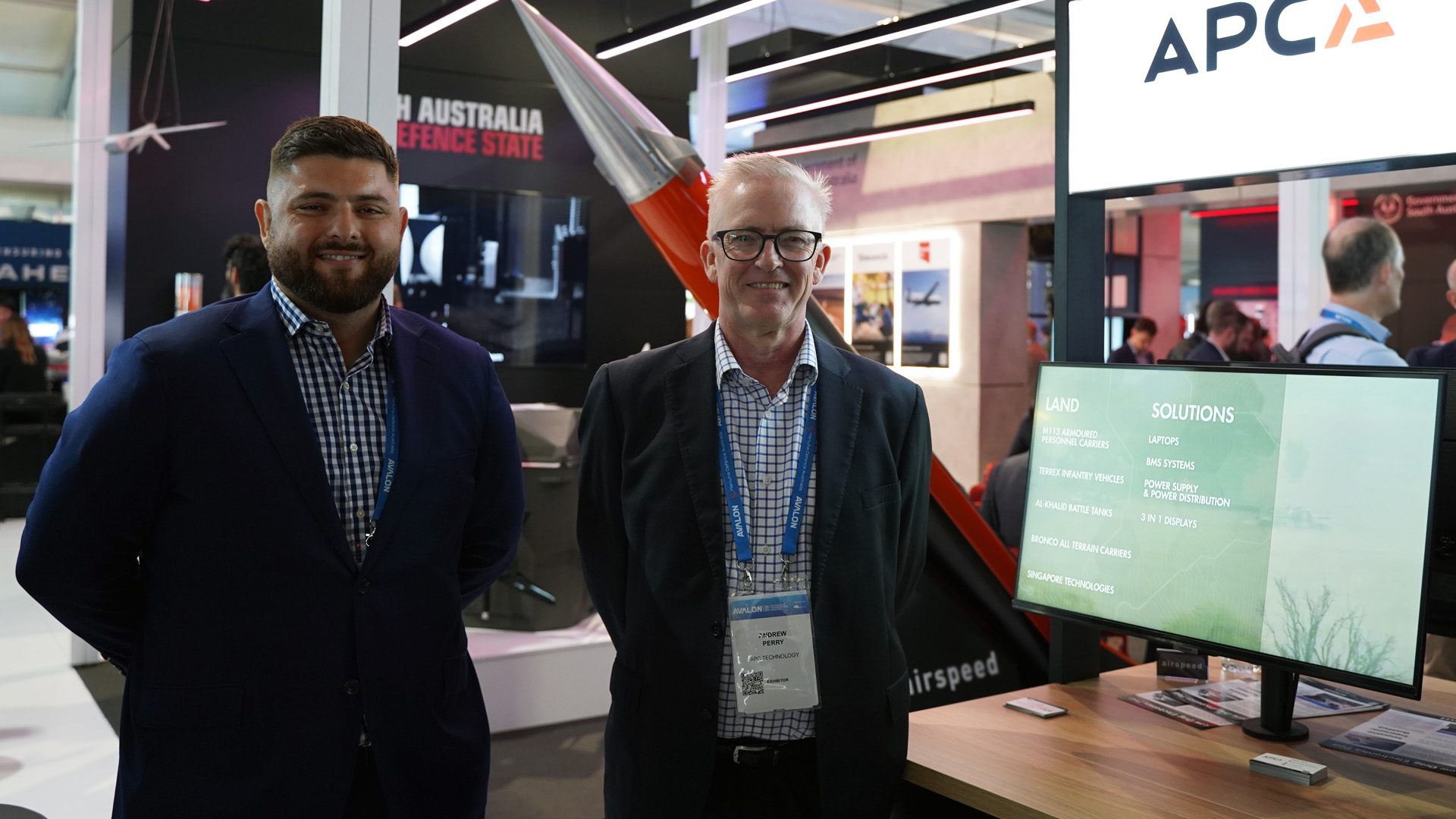 Photo of two people at a trade show