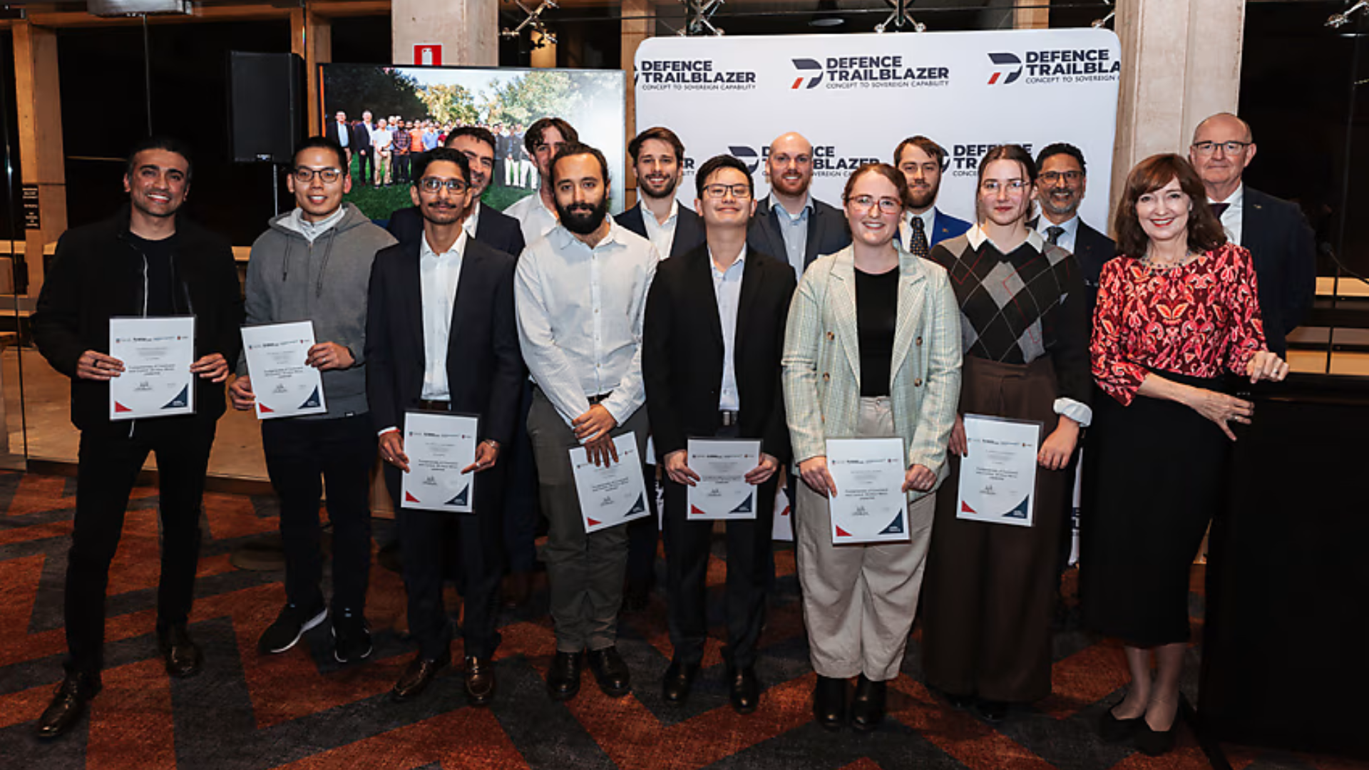 Dr Susan Close, Dr Sanjay Mazumdar, and Warren McDonald, pictured together with graduates of Australia’s first of credit-ready Combat Systems Engineering Micro-credentials.