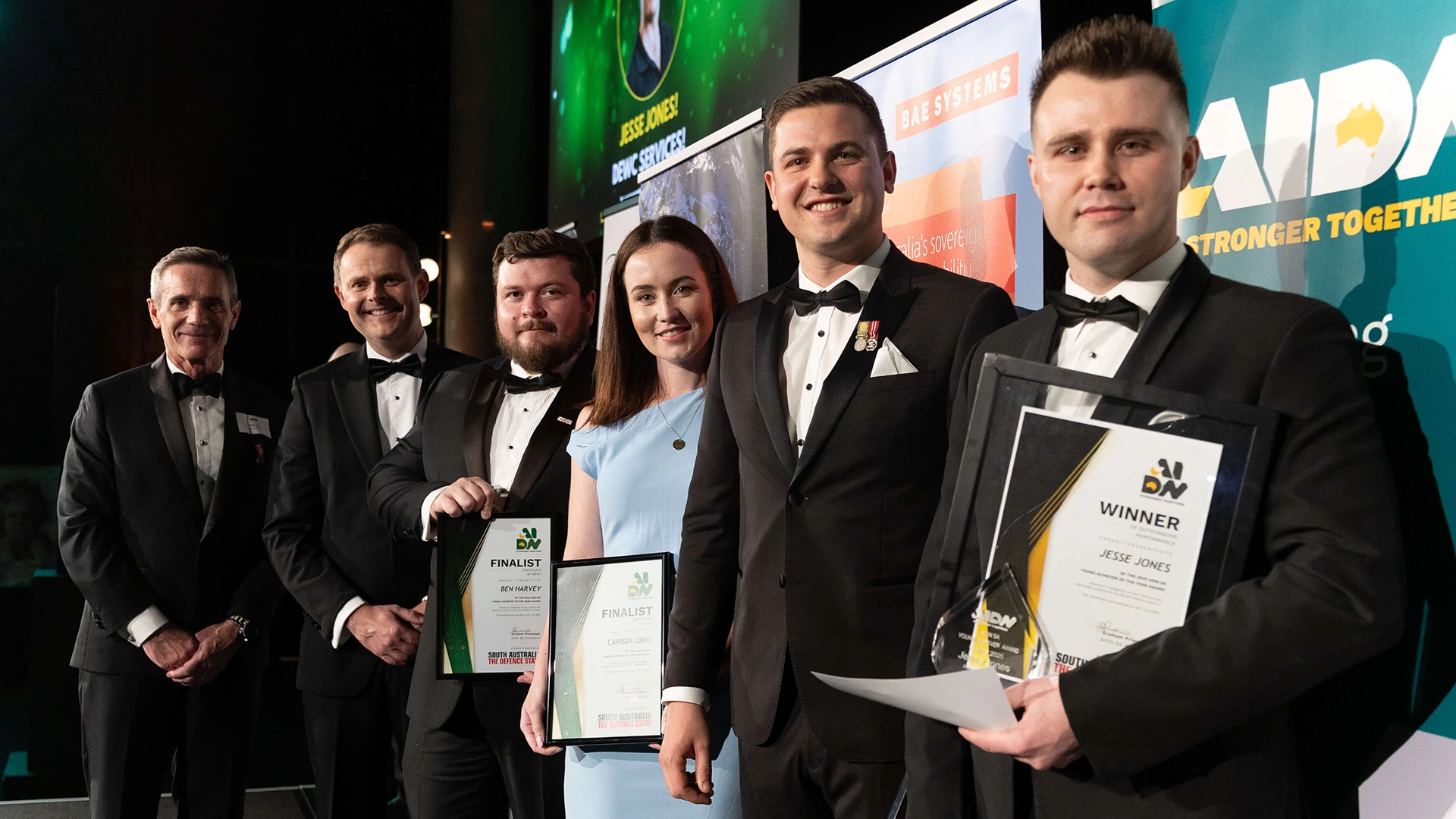 Defence SA Chief Executive Officer, Matt Opie, Ben Harvey of SAHR, Carissa Ionni of Aurecon, Matthew Majewski of BAE Systems Australia, The Hon. Stephen Mullighan, Minister for Defence and Space Industries, Minister for Police, Member for Lee, AIDN SA President, Graham Priestnall and 2025 AIDN SA Young Achiever of the Year Winner - Jess Jones of DEWC Services.
