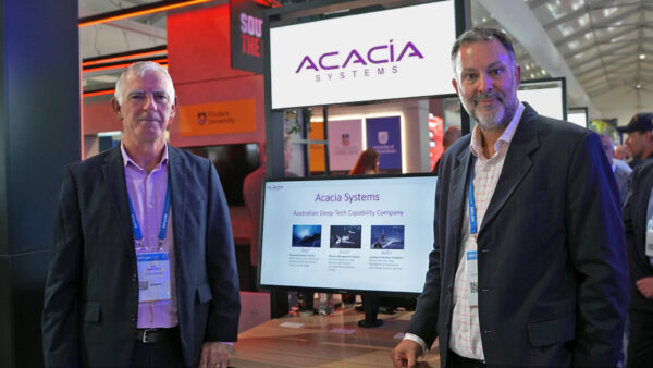 Jon Cooke and Bob Humphreys of Acacia Systems standing at Defence SA’s South Australia – the Defence State exhibit at Avalon 2025.
